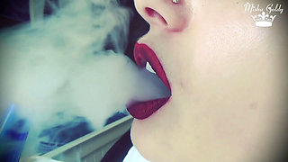 Smoke from dark red big lips