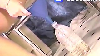 Keisha Dominguez pissing in a water bottle
