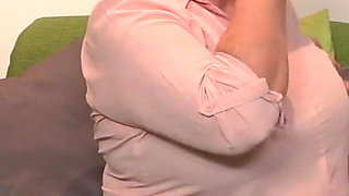 Big Butt Granny Astrid Fingers Her Mature Pussy on the Sofa