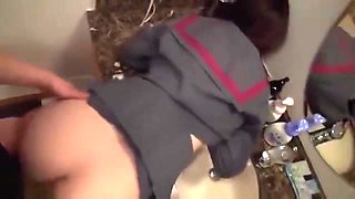 She exposes half of her breasts, inserts them into a shaved pussy, and cums on her face.