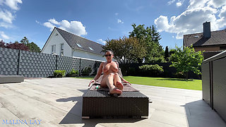 Hot milf pampers her sexy body on the terrace and oils herself