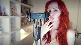 Redheaded pierced teen close up toy show