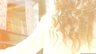 Petite brunette MILF strips nude in car