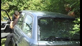 Blonde German cougar with big tits rides dick in the trunk of a car
