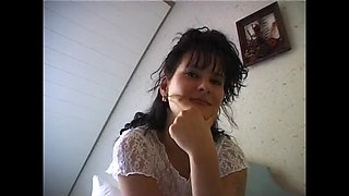 Hairy brunette cutie with small tits rubs her bushy snatch