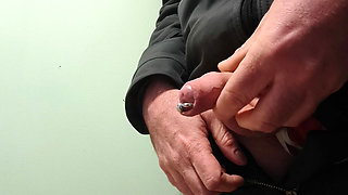 Masturbation and cumshot in a condom at work.