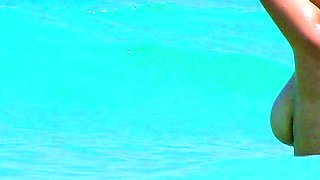 Smoothest nudist play in the warm water  at a nudist beach