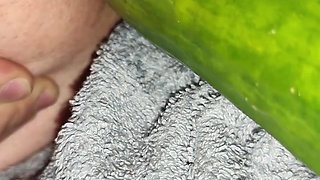 My wife is fucking my ass with a huge cucumber.