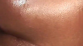 An oiled ebony chick with big ass fucked from BBC dude