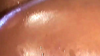 Horny ebony gets banged in her wet oiled pussy