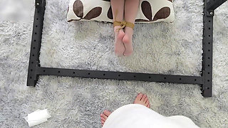 Metal Binds Her Hands, Ropes Bind Her Feet, and Her White Silk Feet Tickle