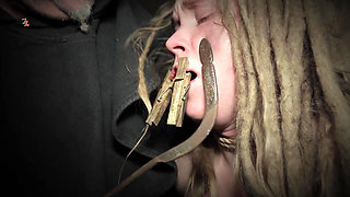 Clamps at the Body of a Tied up Moaning Witch