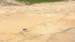 Teasing in Red Bikini on the Beach