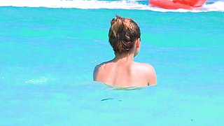 Smoothest nudist play in the warm water  at a nudist beach