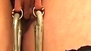 Chained Mature Brunette MILF Endures Nipple Weights and Spanking