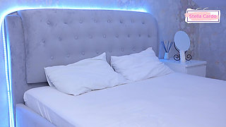 Pours oil on breasts for massage