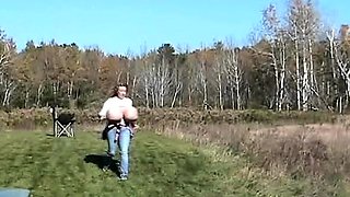 Blonde is flashing her big boobs in the outdoors