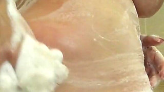 Camilla scrubs up in the shower