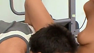 Buff guy licks and fucks sexy slut's tight pussy next to exercise equipment