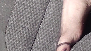 Feet of Nylonjunge in Pantyhose in Car