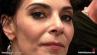 Busty slave fucks dominatrix in public