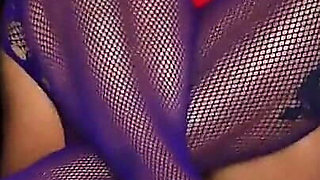 Kepi Carter Plays with Her Pussy in Purple Fishnets