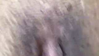 A Close-up of a Naked Pussy Is Spread Out by Her Hand and a Hot