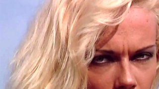 Lustful blonde Kelly Trump masturbates on rocks