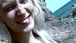 Sexy blonde giving her ass on the beach