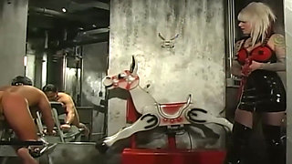 Tattooed Latex Mistress Dominates Her Collared Male Slave