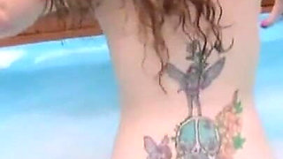 Gina is a tattooed girl who fucks herself with sex toys