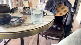 MrsMrJones sips coffee from a clear shirt flaunting pierced nipples in a bustling public cafe as
