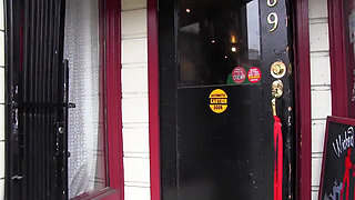 Two dykes in the kitchen playing with ice cream