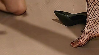 Ballbusting in fishnet stockings