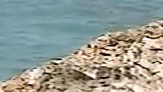 Horny Redhead Babe Fingers Pussy on Wild Beach