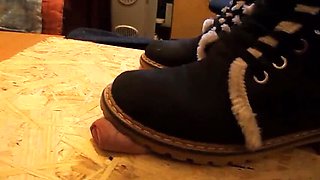 Domina crushes cock with high heels