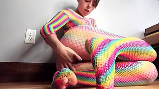 Teen in Rainbow Fishnets Fingers Herself