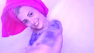 Skinny Girl Applying Oil to Her Body