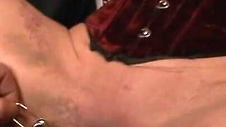 Dominating wax and dildo play
