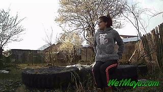 Peeing on some old tires in the yard