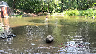 Cute Teen in Costume Playing in the River Like in a Swimming Pool