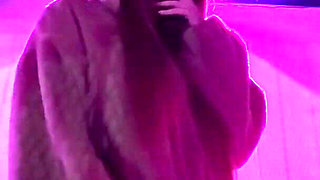 Smoking a Cigarette Outdoor While Wearing Only a Bikini and a Jacket