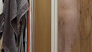 A Busty BBW Showering in the Shower Cabin, Shaving Her Armpits, Pussy, and Legs.