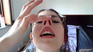 Smiley brunette teen in glasses showing off her petite body solo