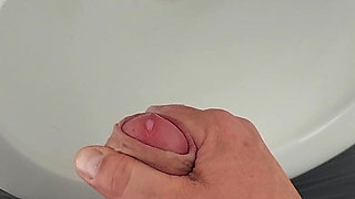 Moaning daddy has a lot of pressure and milks his cock in the public toilet