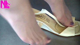 Nyllady Putting on Pantyhose and Footplay with Milk Colored Wedges