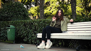Young Brunette Is Taking an Unhurried Stroll with Allwhite 120mm Cigarette