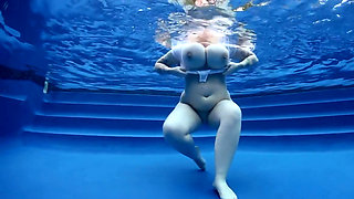 BBW babe shows off huge naturals in the pool underwater POV