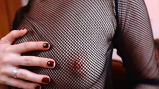 Redheaded slut in lingerie licks own huge rack pov style