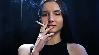 Elegant Brunette Smoking in Black Outfit